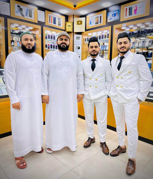 Image of the four founders of Zam Zam Electronics, Mirza Farooq Baig, Muhammad Rauf, Abdul Ghafoor, and Muhammad Shakoor, standing together with smiles.